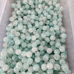 10mm glass beads. Mint Green with Brown splatter Beads